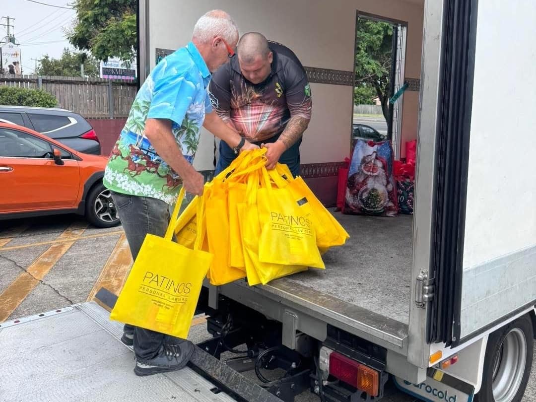 Loading Patinos gift bags for the Logan Emergency Services Santa Run